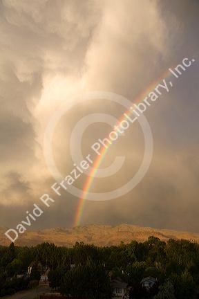 Rainbow over the foothills and city of Boise, Idaho, USA.