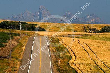 Teton Range in the distance along Idaho Highway 32 near Ashton, Idaho, USA.
