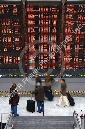 Departure board located in the Paris-Charles de Gaulle Airport, Paris, France.