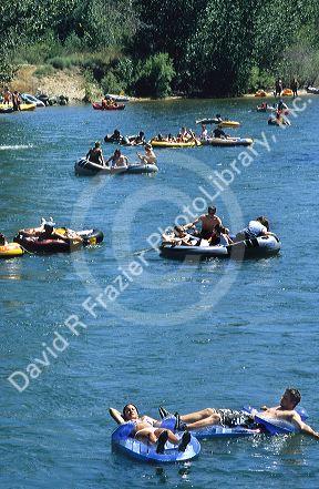 People float down the Boise River on inner tubes and rafts in Boise, Idaho.