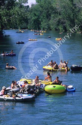 People float down the Boise River on inner tubes and rafts in Boise, Idaho.