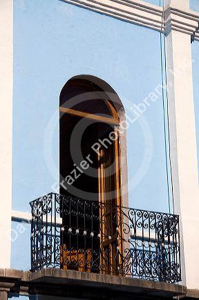 Door opening to a balcony in the city of Puebla, Puebla, Mexico.