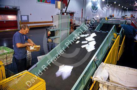 Mail on an edger/feeder belt at a automated postal facility in Boise, Idaho.