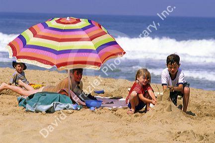 Children build sandcastles on the beach at Vina del Mar, Chile.