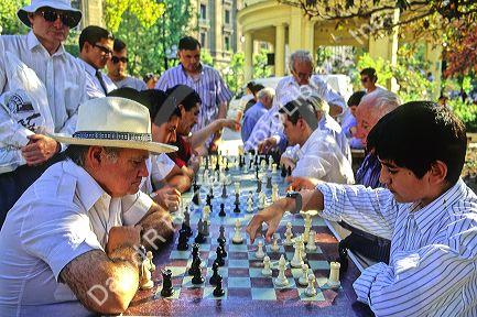 Chilean man and boy playing chess in Santiago, Chile.
