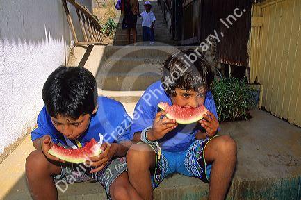 Chilean boys eat watermelon in Santiago, Chile.