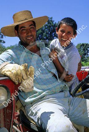 Chilean farmer and son in the Central Valley of Chile.