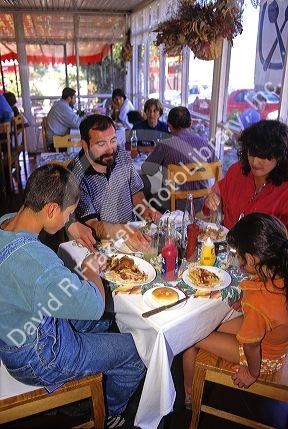Chilean family dining at a restaurant in Santiago, Chile.