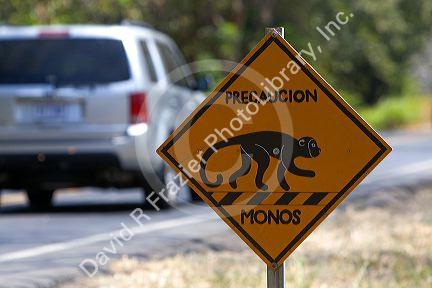 Road sign on the Pan American Highway cautions monkey crossing in Costa Rica.