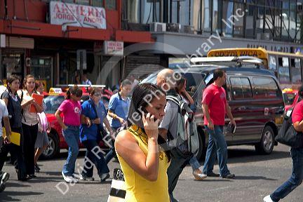 Costa Rican woman using a cell phone in San Jose, Costa Rica.