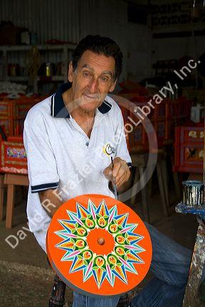 Carretas are elaborately painted oxcarts in the city of Sarchi Norte, Cosat Rica.  This view is a detail of a wheel.