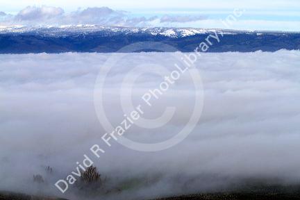 Valley fog and the Cascade Range near Ellensburg, Washington, USA.