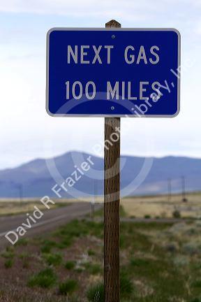 Next gas 100 miles road sign at the Oregon/Nevada border in McDermitt, USA.