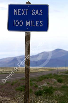 Next gas 100 miles road sign at the Oregon/Nevada border in McDermitt, USA.