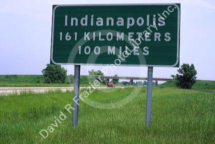 Road sign showing distance in kilometers and miles along Interstate 70 near Indianapolis, Indiana, USA.