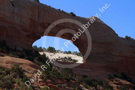 Wilson Arch is a natural sandstone arch along U.S. Route 191 near Moab, Utah, USA.