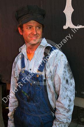 Steam locomotive fireman on the Durango and Silverton Narrow Gauge Railroad located in Durango, Colorado, USA.