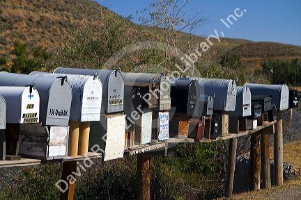 Mailboxes lined up for the delivery of mail in a rural area near Challis, Idaho, USA.
