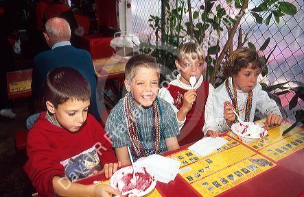 Quadruplets eating strawberry shortcake at Parkdale Farms in Plant City, Florida.