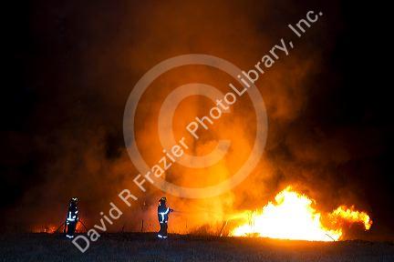 Firefighters work to contain a fire near Federal Way and Kootenai streets in Boise, Idaho, USA. August 21, 2010