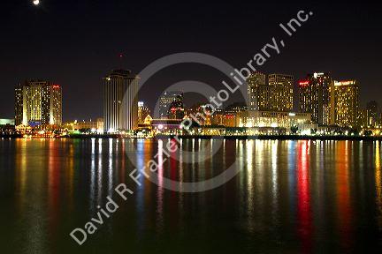 Night skyline of the city of New Orleans along the Mississippi River, Louisiana, USA.