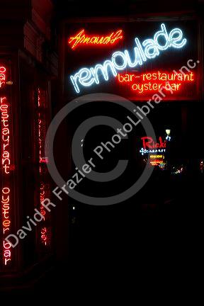 Remoulade oyster bar neon sign on Bourbon Street in the French Quarter of New Orleans, Louisiana, USA.