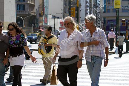 Pedestrians on Avenida 9 de Julio in Buenos Aires, Argentina.