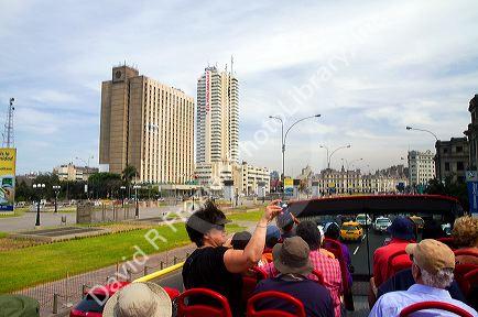 View of hotels from the upper deck of a tour bus in Lima, Peru.