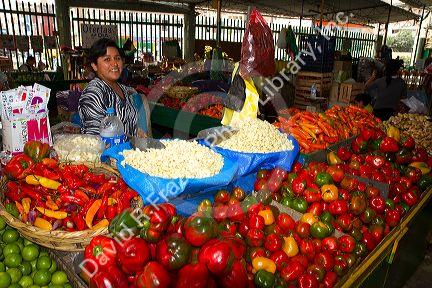 Vendor at a cooperative produce market in the Chorrillos district of Lima, Peru.