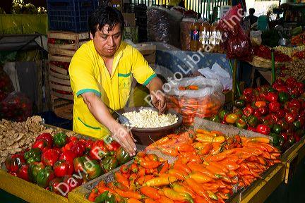 Vendor at a cooperative produce market in the Chorrillos district of Lima, Peru.