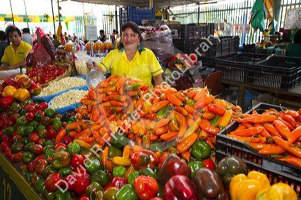 Vendor at a cooperative produce market in the Chorrillos district of Lima, Peru.