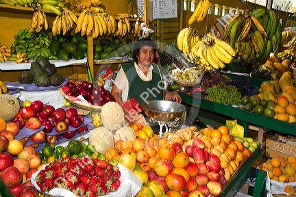 Vendor at a cooperative produce market in the Chorrillos district of Lima, Peru.