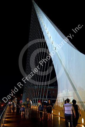 The Puente de la Mujer footbridge at night in the Puerto Madero district of Buenos Aires, Argentina.