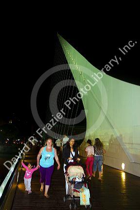 The Puente de la Mujer footbridge at night in the Puerto Madero district of Buenos Aires, Argentina.