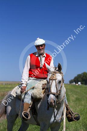 Gaucho riding horseback on the Pampas of Argentina.