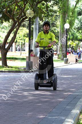 Park security riding a segway in Central Park of the Miraflores district of Lima, Peru.