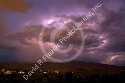 Lightning strikes during a thunderstorm on the first day of summer in Boise, Idaho, USA.