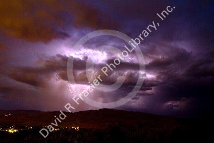 Lightning strikes during a thunderstorm on the first day of summer in Boise, Idaho, USA.