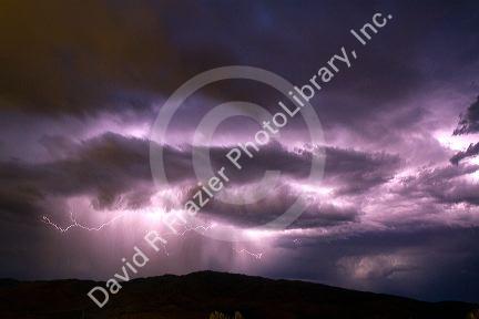 Lightning strikes during a thunderstorm on the first day of summer in Boise, Idaho, USA.