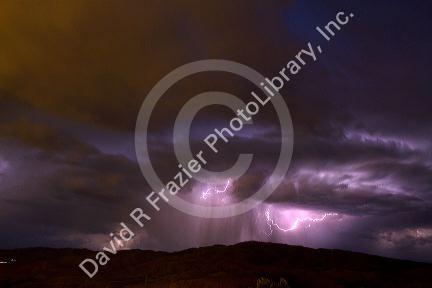 Lightning strikes during a thunderstorm on the first day of summer in Boise, Idaho, USA.