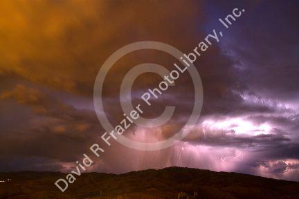 Lightning strikes during a thunderstorm on the first day of summer in Boise, Idaho, USA.