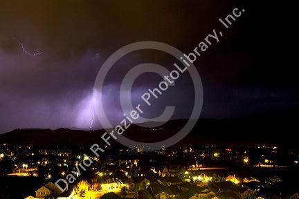Lightning strikes during a thunderstorm on the first day of summer in Boise, Idaho, USA.