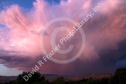 Summer storm cloud at sunset over the foothills near Boise, Idaho, USA.