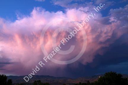 Summer storm cloud at sunset over the foothills near Boise, Idaho, USA.