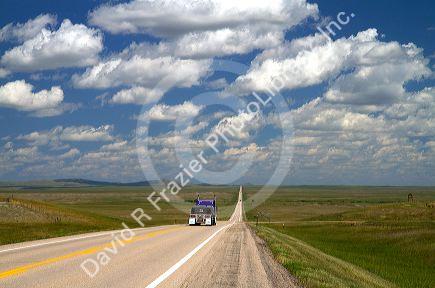 Semi truck traveling on highway 85 north of Spearfish, South Dakota, USA.