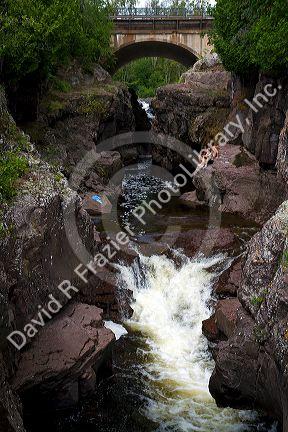 Waterfall and footbridge on the Temperance River near Tofte in northern Minnesota, USA.