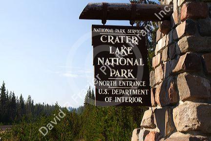 Crater Lake National Park entrance sign located in southern Oregon, USA.