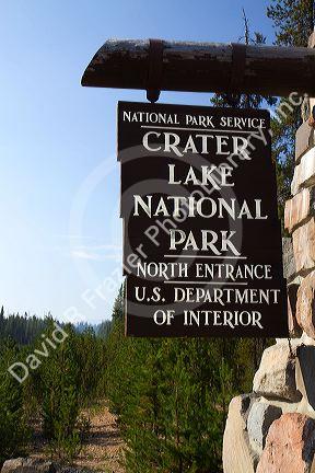 Crater Lake National Park entrance sign located in southern Oregon, USA.