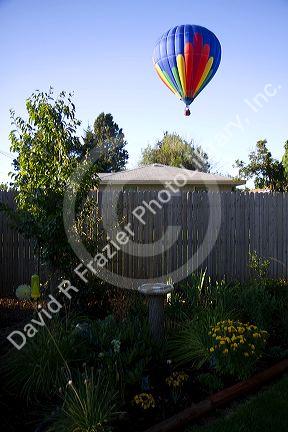 Hot air balloon landing in a residential area of Boise, Idaho, USA.