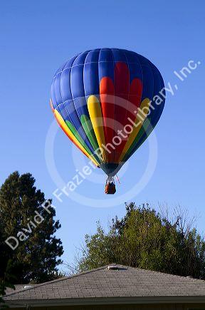 Hot air balloon landing in a residential area of Boise, Idaho, USA.